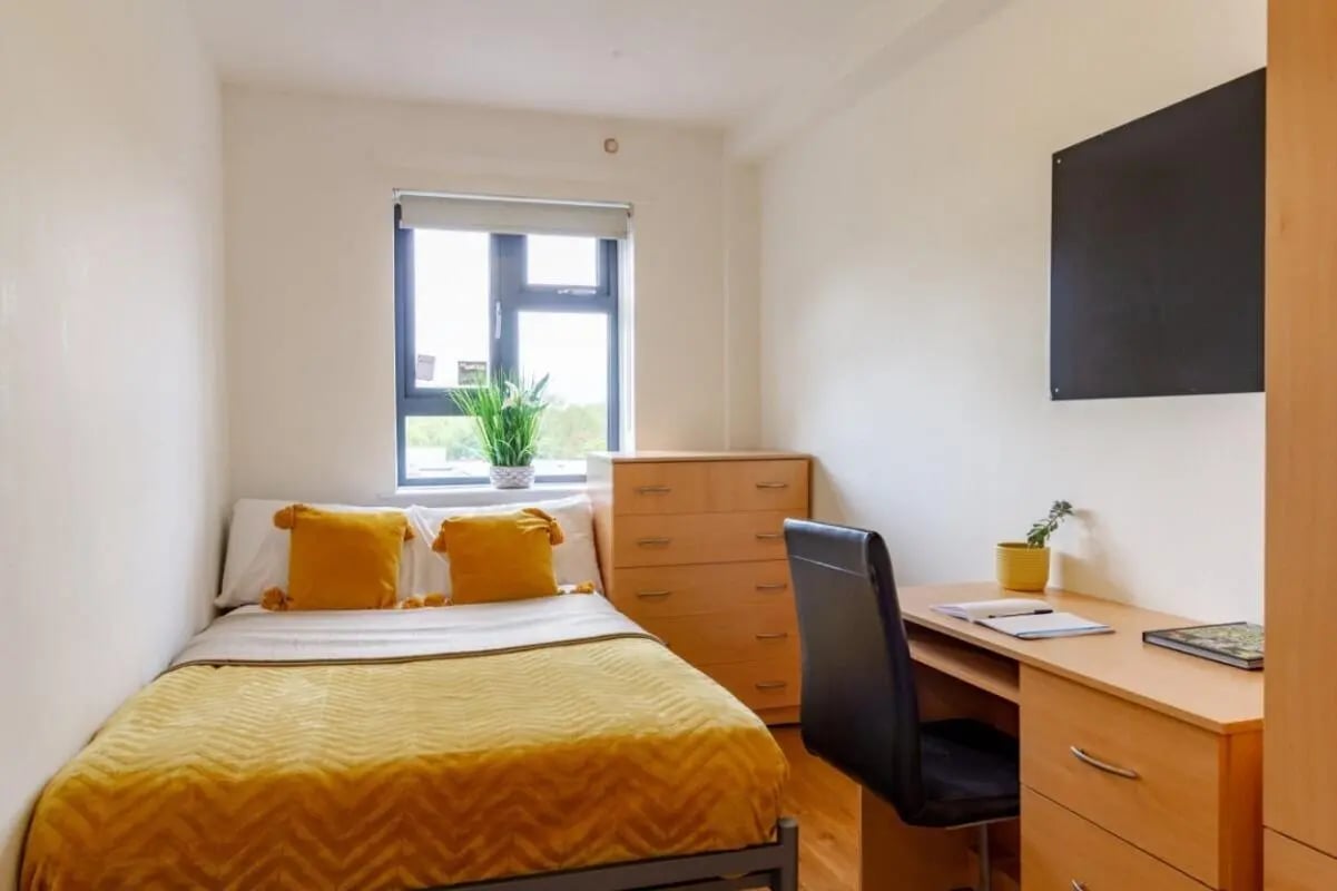 Bed desk chest of drawers television bedroom at Surrey Quays Landale House in London Student Accommodation