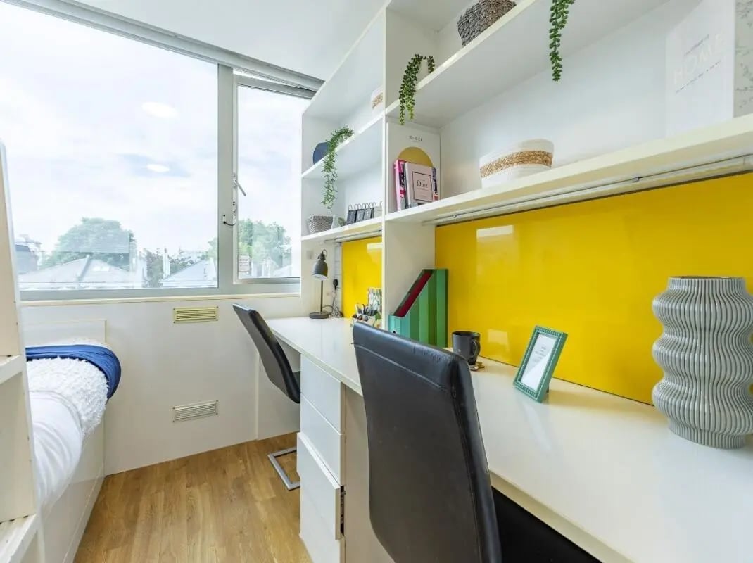 Two desks with chairs and shelves study area at Chelsea Lightfoot Hall in London Student Accommodation