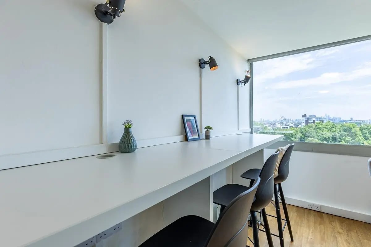 Counter with vases chairs and city view study area at Chelsea Lightfoot Hall in London Student Accommodation