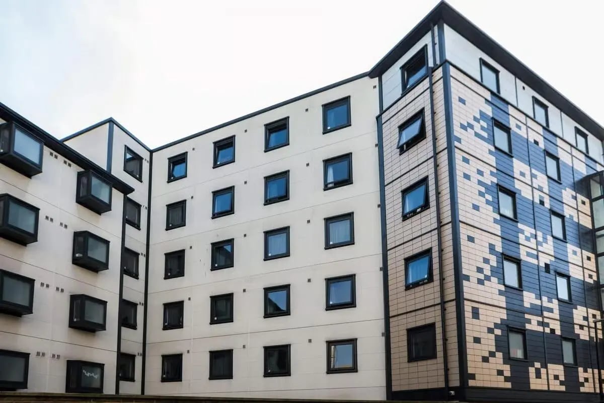 Modern apartment building with many windows exterior at Harbour Court in Bristol Student Accommodation