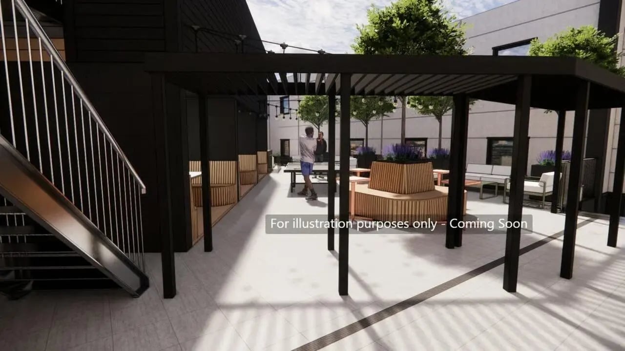 Outdoor seating area with tables and chairs patio at Harbour Court in Bristol Student Accommodation