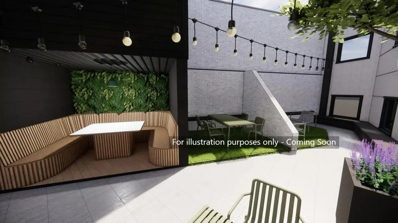 Seating tables chairs plants courtyard exterior at Harbour Court in Bristol Student Accommodation