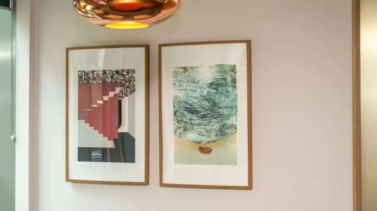 Two framed abstract artworks on wall at Flora Building - Hoxton in London Student Accommodation