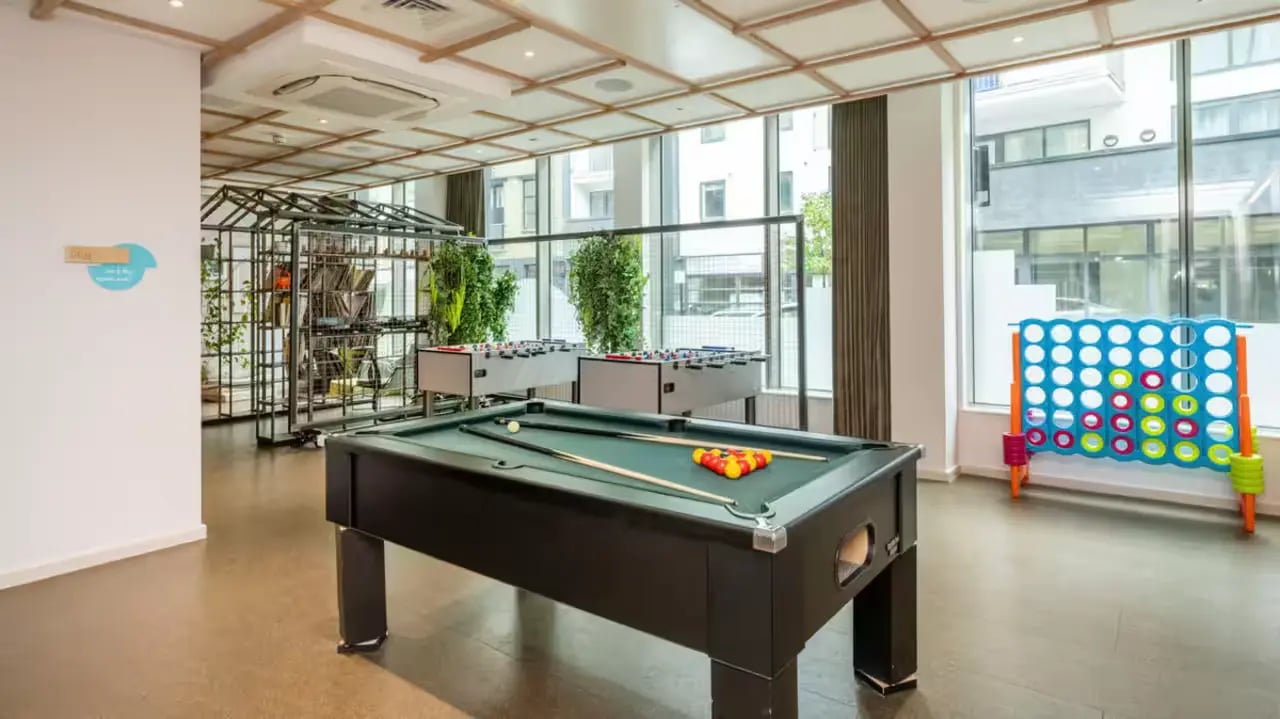 Pool table foosball connect four gaming area at Flora Building - Hoxton in London Student Accommodation