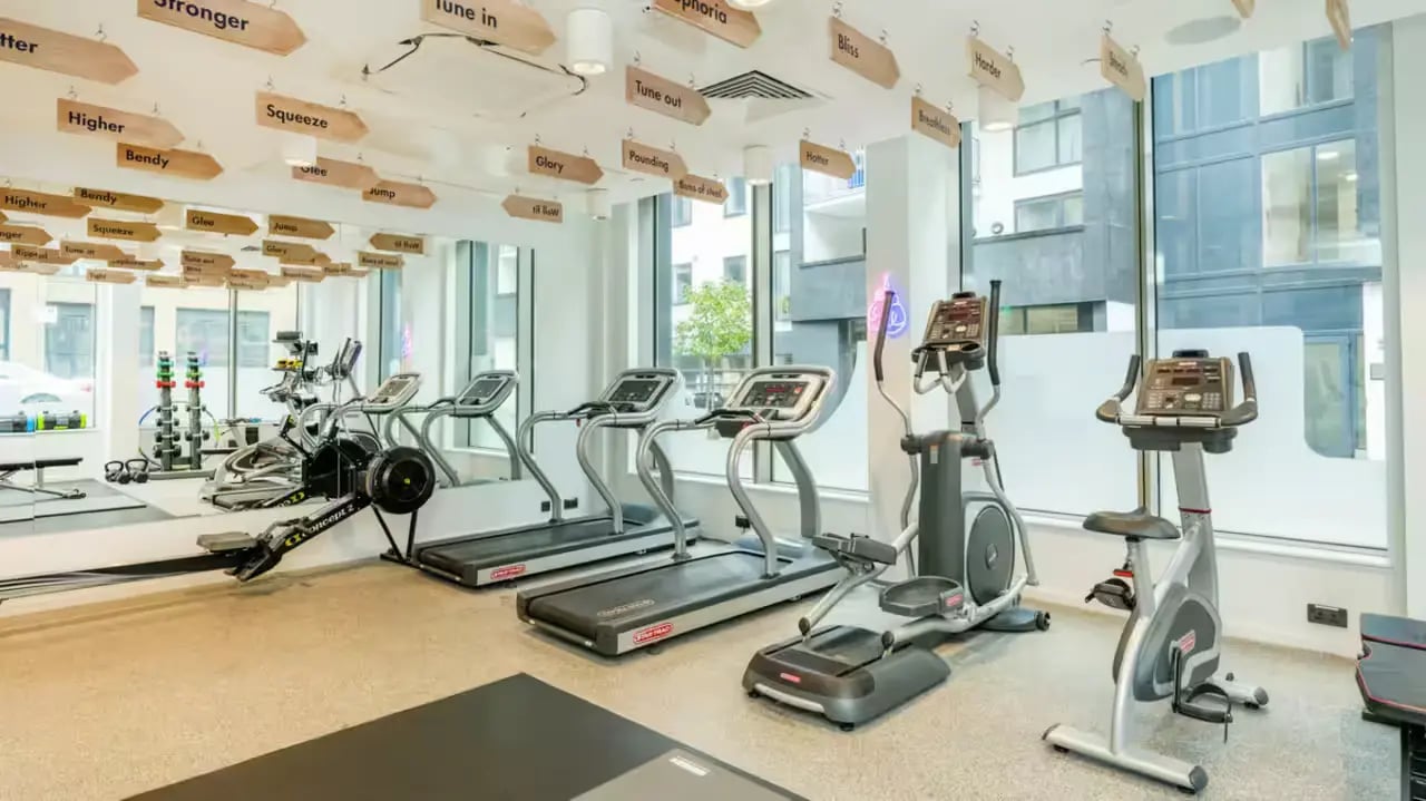 Treadmills rowing machine exercise bikes gym area at Flora Building - Hoxton in London Student Accommodation