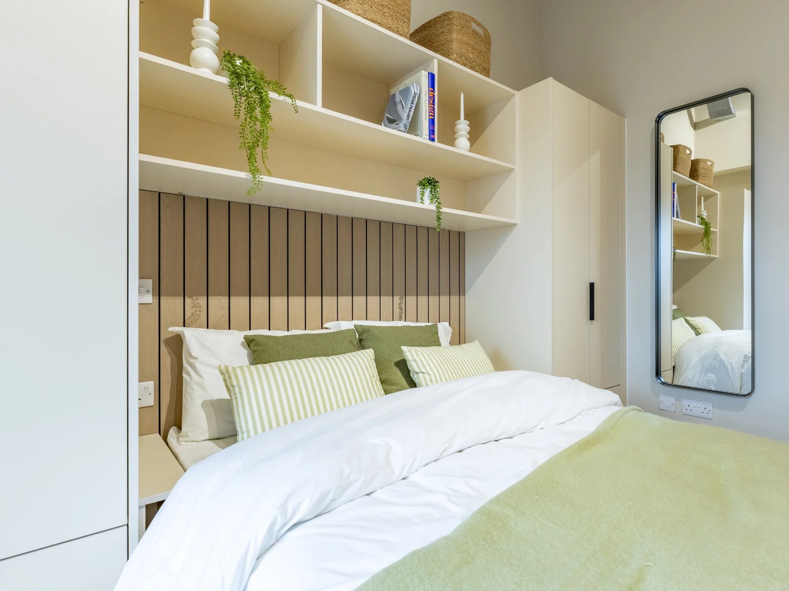 Bed with pillows shelves and mirror bedroom at Fitz and Knox in Cardiff Student Accommodation
