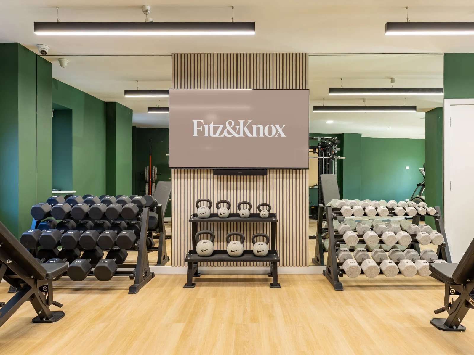 Dumbbell racks kettlebells and television gym at Fitz and Knox in Cardiff Student Accommodation