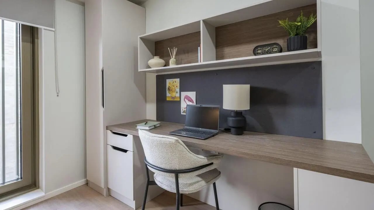 Desk with laptop chair and shelves study area at Broadway Studios in Glasgow Student Accommodation