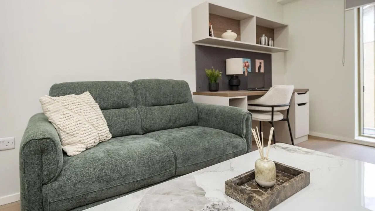 Sofa desk and shelves living room at Broadway Studios in Glasgow Student Accommodation