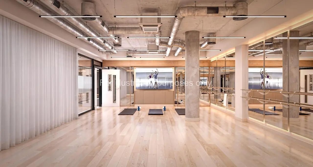 Yoga mats on wood floor mirrored studio at Broadway Studios in Glasgow Student Accommodation