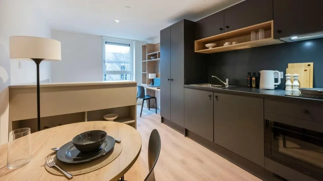 Kitchen table desk and floor lamp kitchen at Straits Place in Edinburgh Student Accommodation