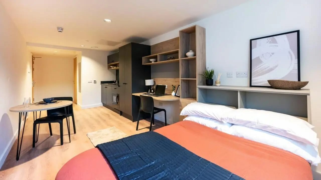 Studio apartment with bed desk kitchen and dining area at Straits Place in Edinburgh Student Accommodation