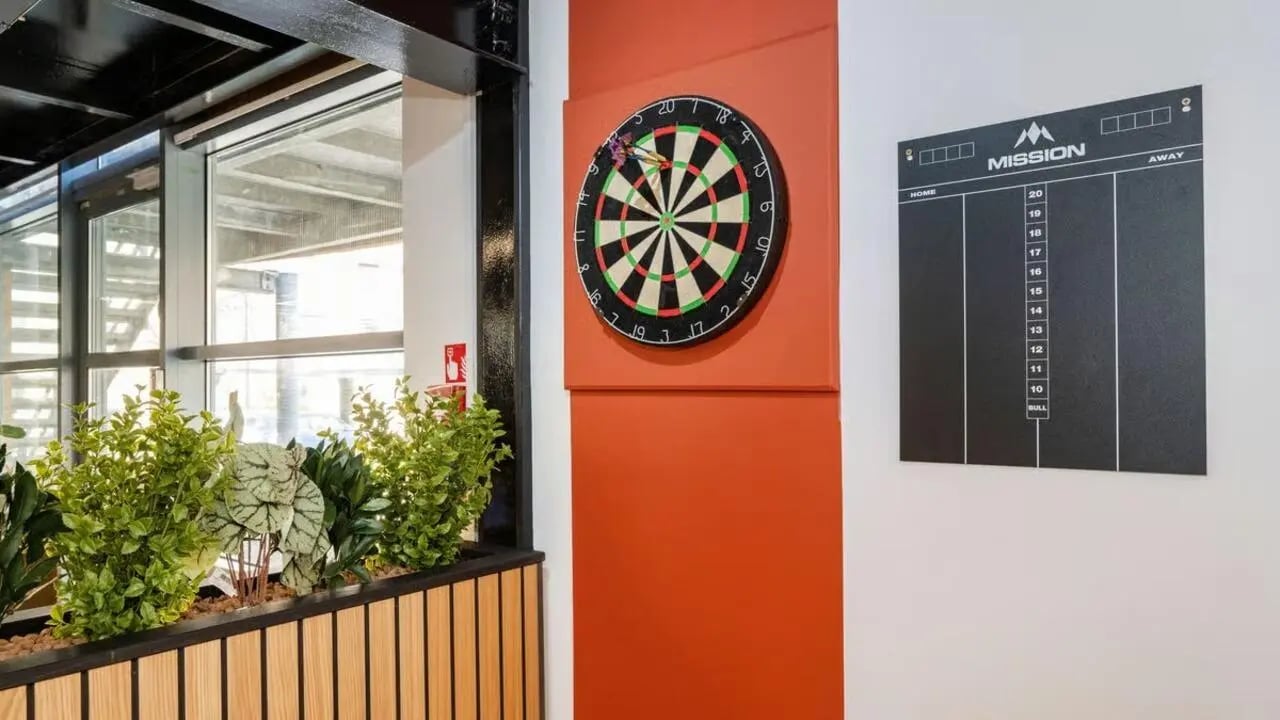 Dartboard and scoreboard near plants common area at Clarence Dock Village in Leeds Student Accommodation