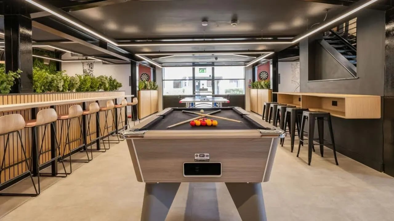 Pool table ping pong tables dartboards bar stools playing area at Clarence Dock Village in Leeds Student Accommodation