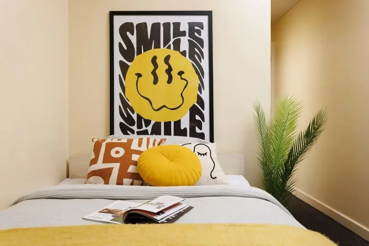 Poster pillows and plant bedroom at Curzon House in Nottingham Student Accommodation