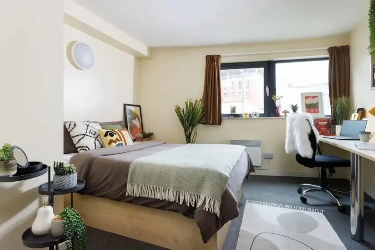 Bed desk plants and chair bedroom at Curzon House in Nottingham Student Accommodation