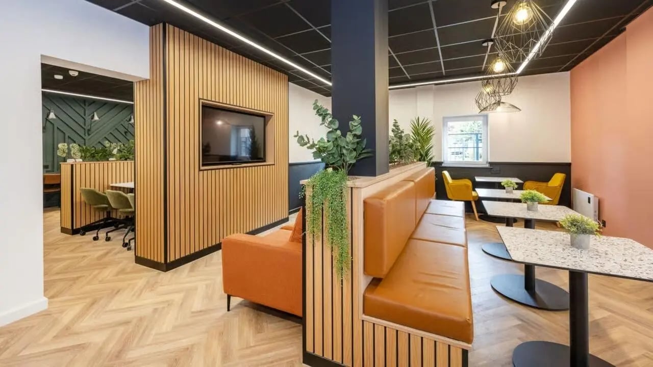 Orange sofa and booth seating communal area at Curzon House in Nottingham Student Accommodation