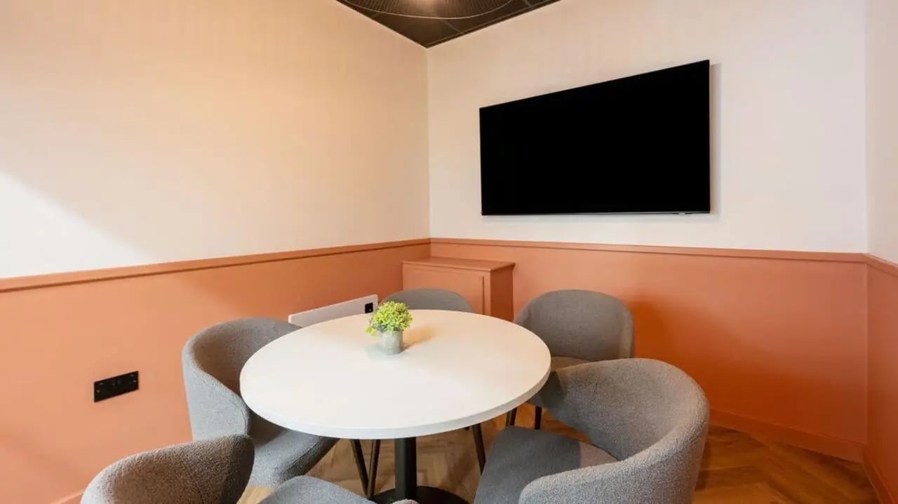 Round table chairs TV on wall study area at Curzon House in Nottingham Student Accommodation