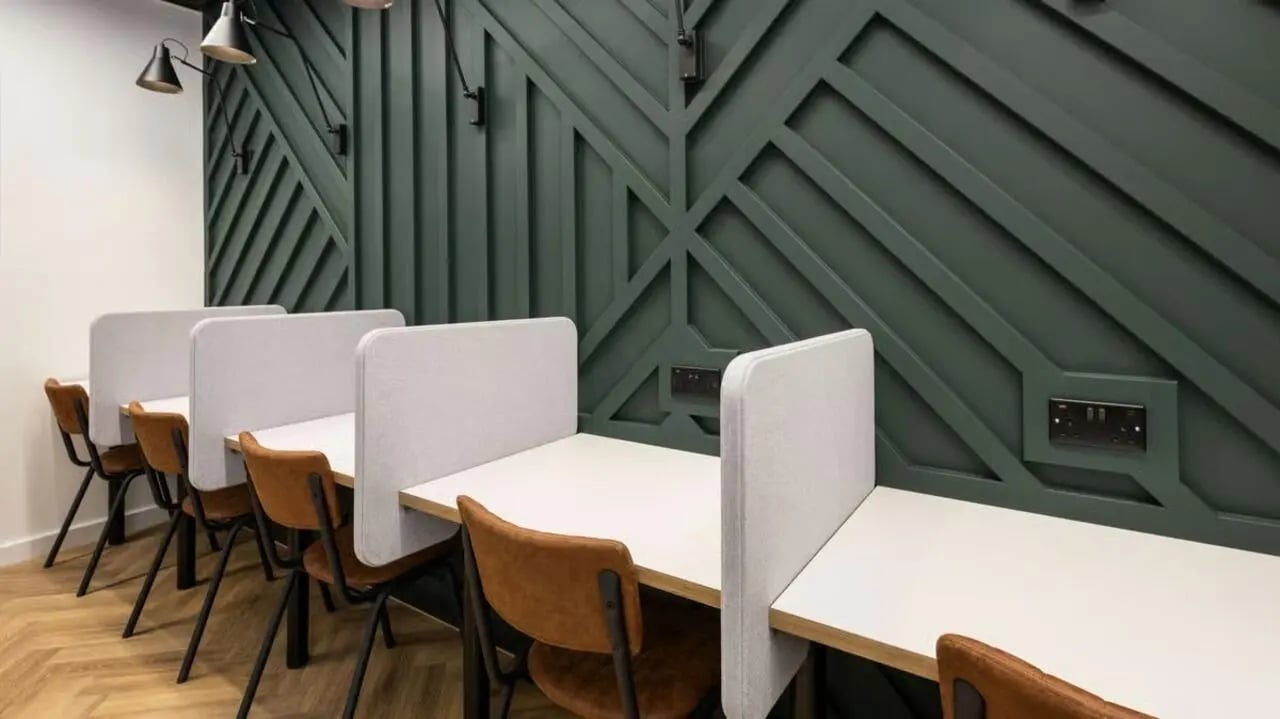 Desks with dividers and chairs study area at Curzon House in Nottingham Student Accommodation