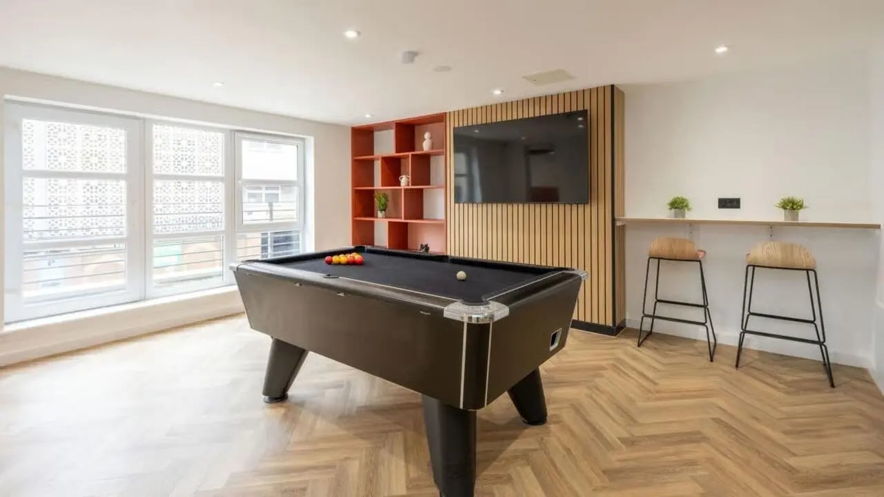 Pool table with balls and bar stools communal area at Curzon House in Nottingham Student Accommodation