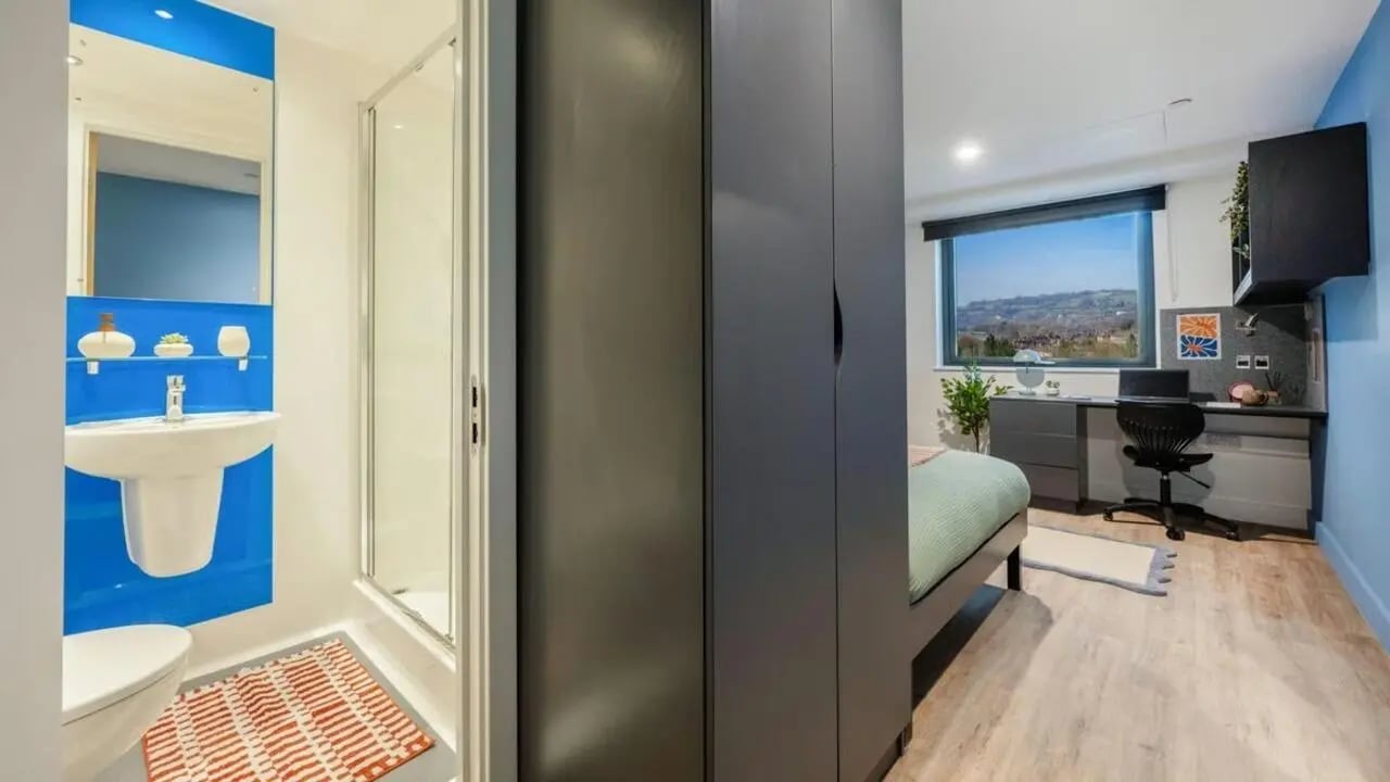 Wardrobe bed desk chair mirror toilet sink shower bathroom bedroom at Hollis Wharf in Bath Student Accommodation