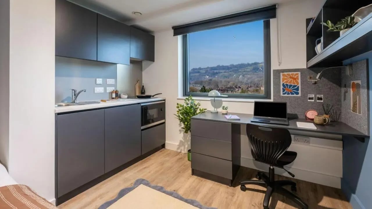 Kitchen study area with laptop desk and view at Hollis Wharf in Bath Student Accommodation