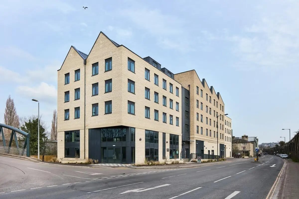 Modern brick building with many windows exterior at Hollis Wharf in Bath Student Accommodation