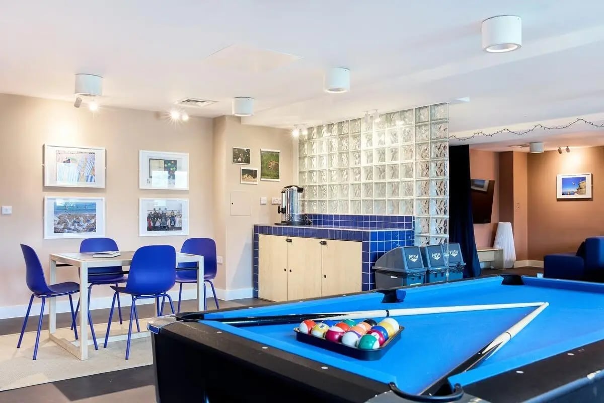 Pool table dining table and pictures communal area at Hollis Wharf in Bath Student Accommodation