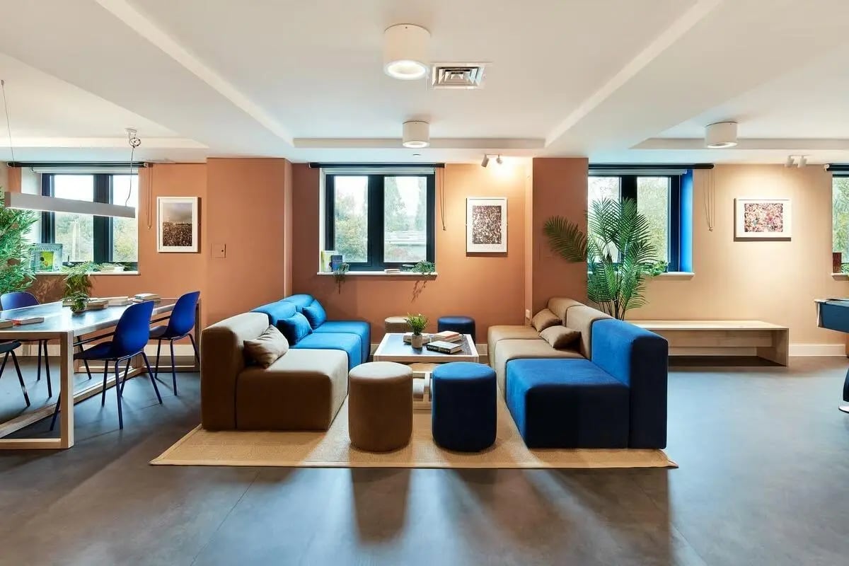 Modular sofas coffee table dining table lounge area at Hollis Wharf in Bath Student Accommodation