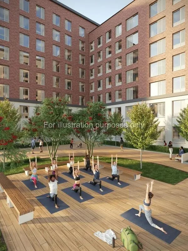 People doing yoga on mats outdoor area exterior at The Propeller Quarter in Bristol Student Accommodation