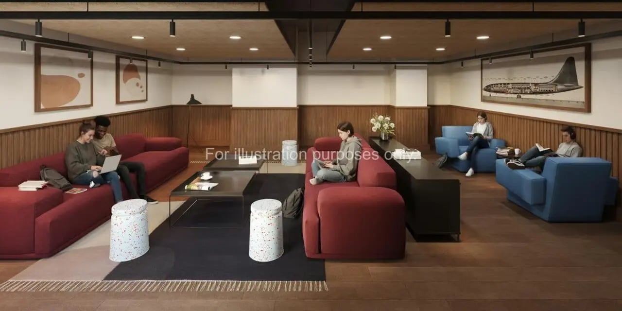 Modern common room with students on sofas and chairs lounge area at The Propeller Quarter in Bristol Student Accommodation