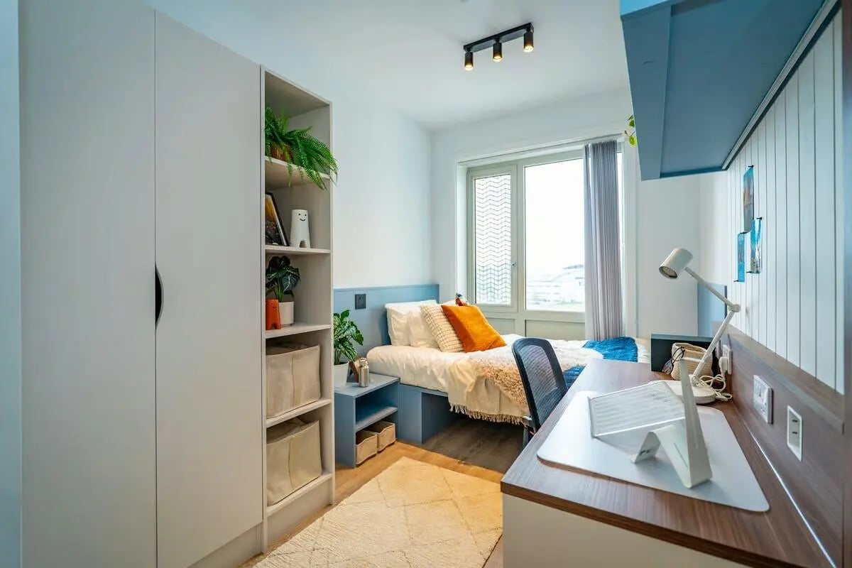 Bed desk shelf plants storage bedroom interior at The Propeller Quarter in Bristol Student Accommodation