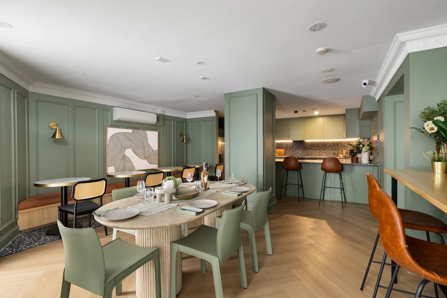 Dining tables chairs with kitchen counter Image Type common area at UKO Potts Point in Sydney Student Accommodation