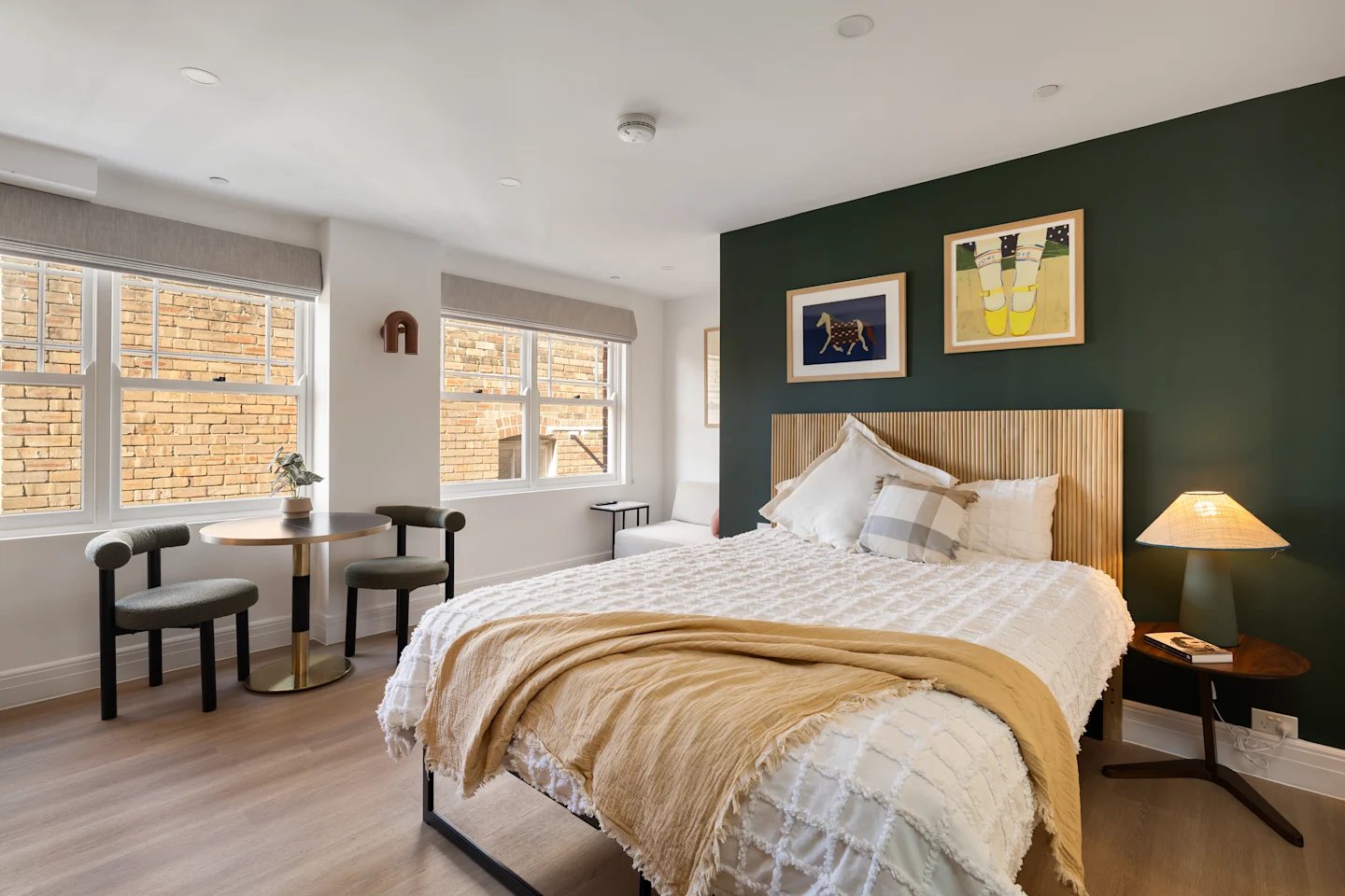 Bed chairs table and artwork bedroom at UKO Potts Point in Sydney Student Accommodation