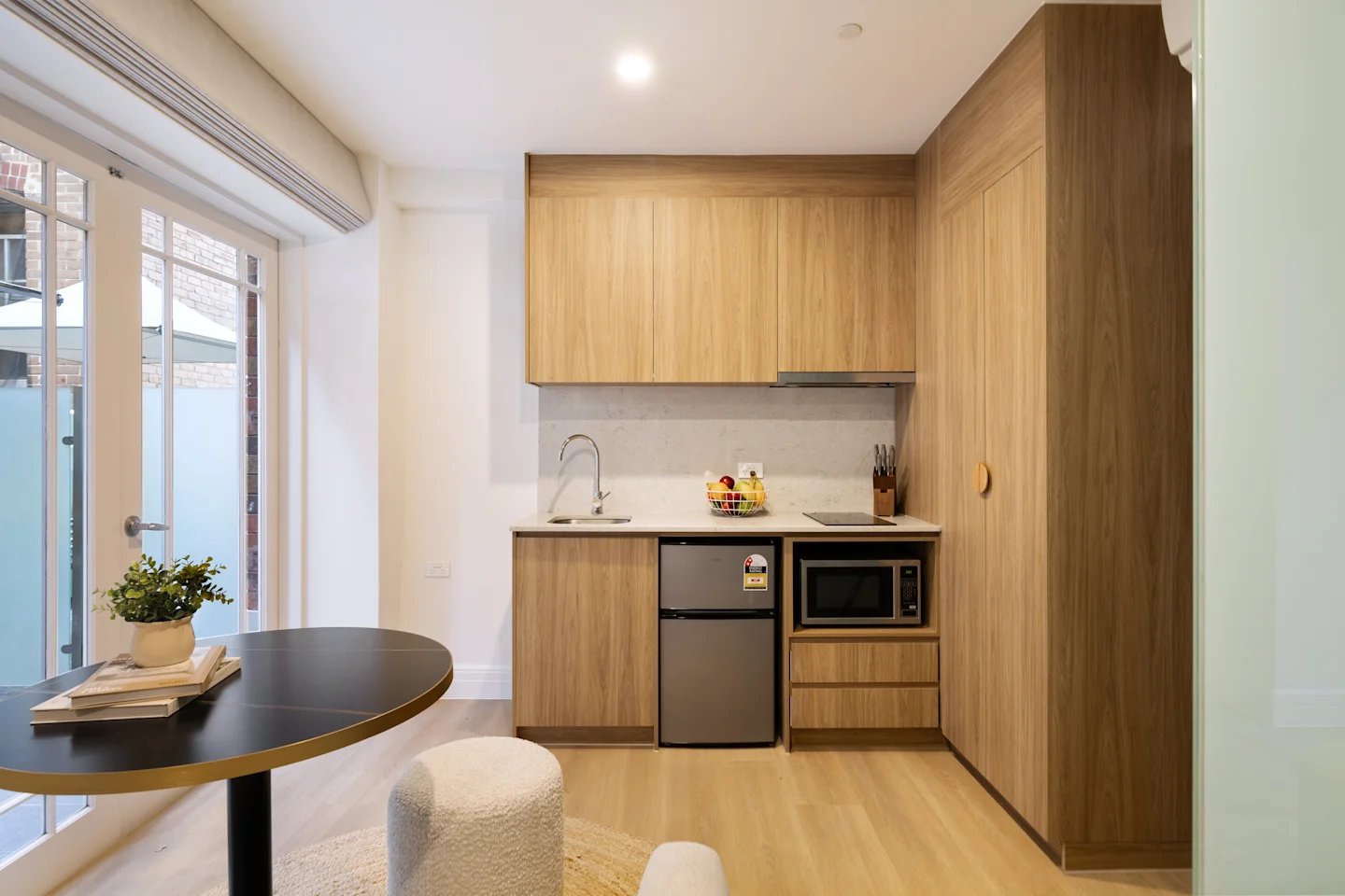 Kitchenette with microwave fridge and sink kitchen at UKO Potts Point in Sydney Student Accommodation