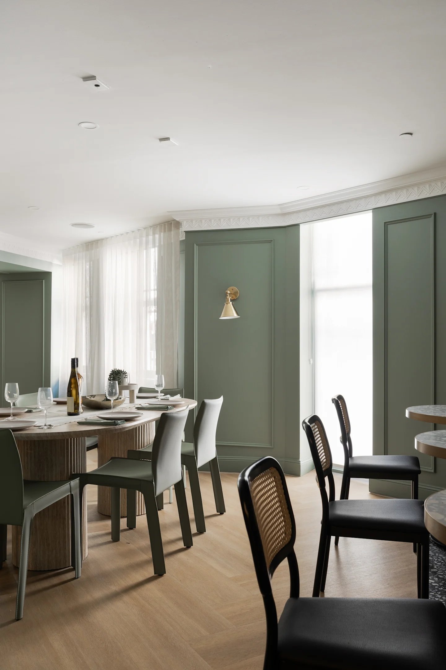 Dining table with place settings and chairs dining area at UKO Potts Point in Sydney Student Accommodation