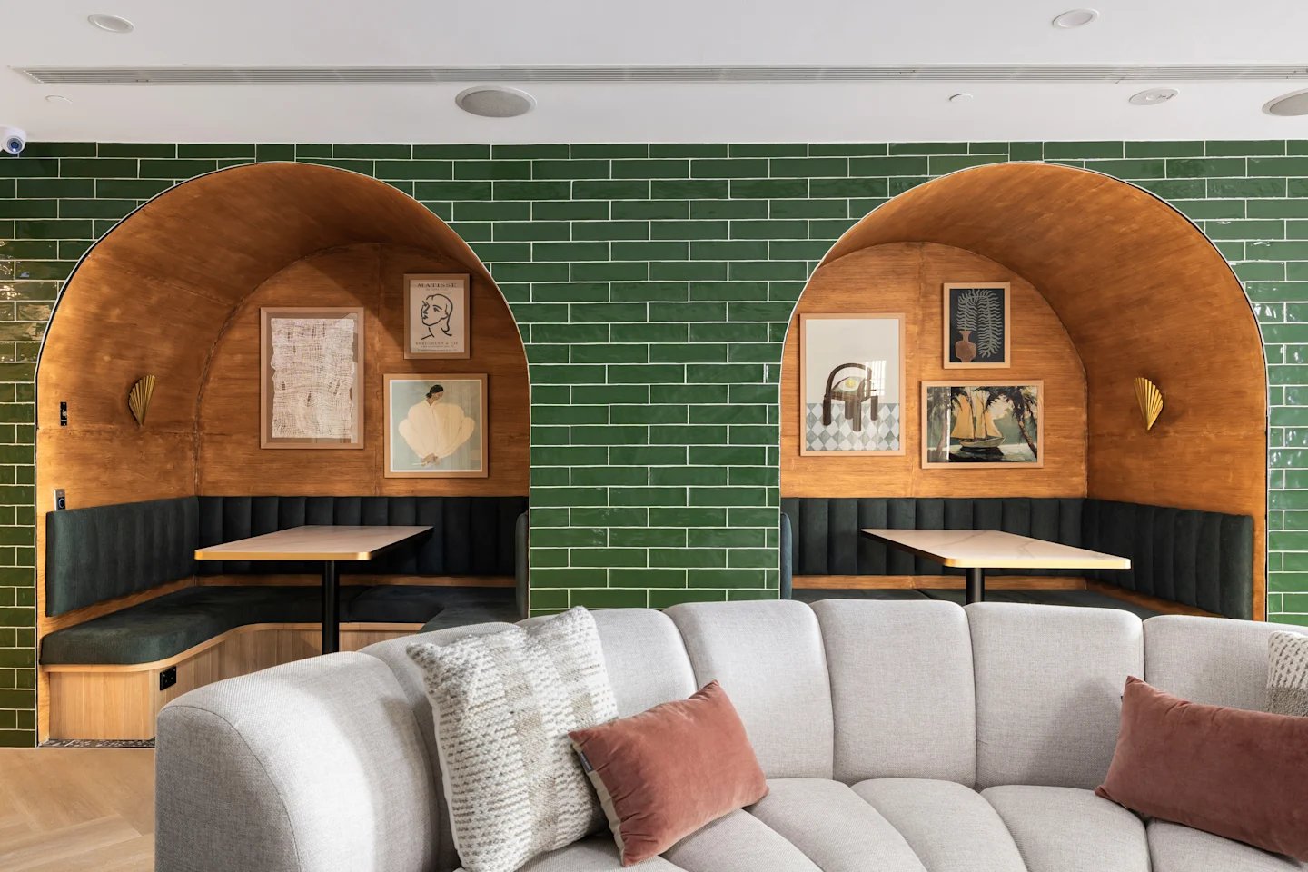 Booths with artwork and sectional sofa living room at UKO Potts Point in Sydney Student Accommodation