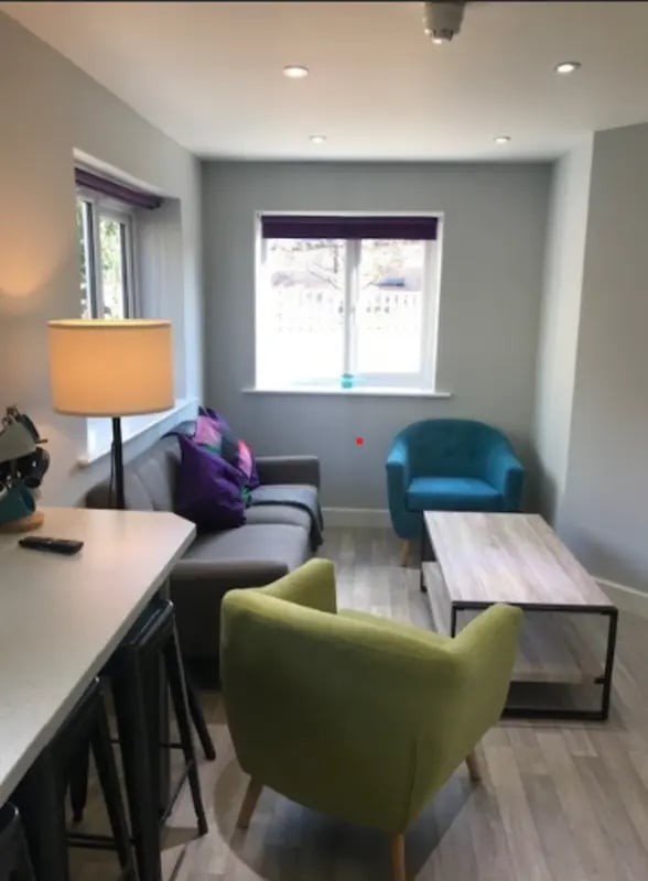 Sofa two chairs coffee table living room at Varsity Beeston in Nottingham Student Accommodation