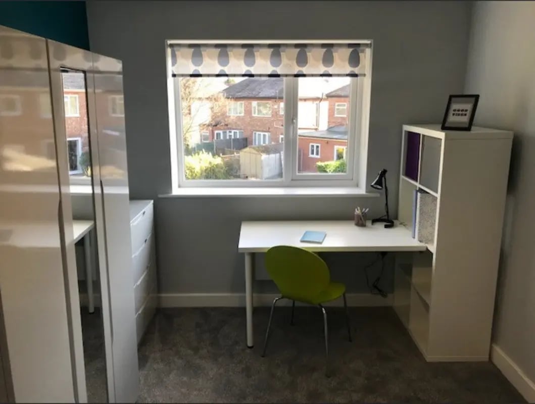 Desk chair lamp shelving unit bedroom at Varsity Beeston in Nottingham Student Accommodation