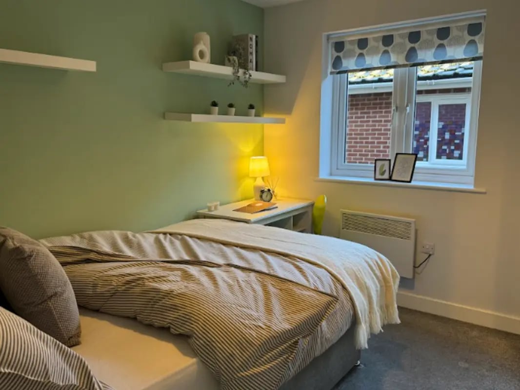 Bed desk and shelves bedroom at Varsity Beeston in Nottingham Student Accommodation