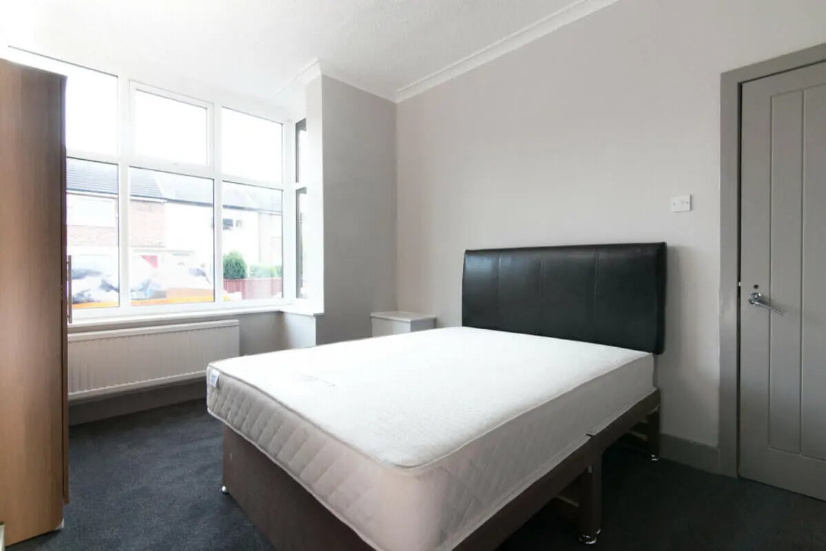 Bed wardrobe window and door bedroom at 3 Bedroom House at 93, Gerald Road in Salford Student Accommodation