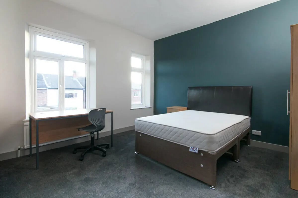 Bed desk chair near window Bedroom at 3 Bedroom House at 93, Gerald Road in Salford Student Accommodation