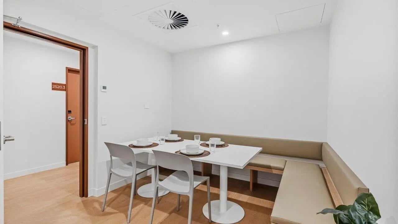 Dining table with chairs and bench seating kitchen at UniLodge Brisbane City in Brisbane Student Accommodation