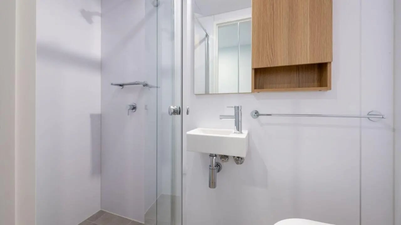 Shower sink mirrored cabinet towel rack bathroom at UniLodge Brisbane City in Brisbane Student Accommodation