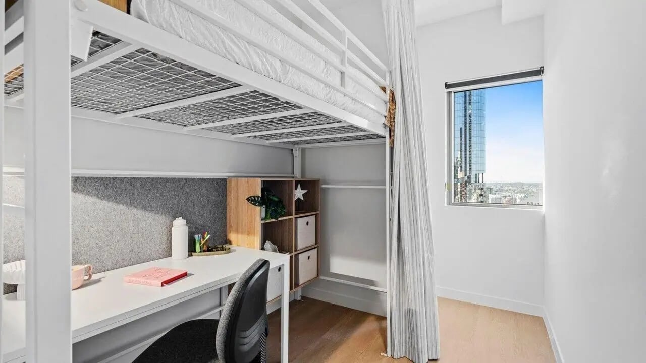 Loft bed desk chair and shelves study area at UniLodge Brisbane City in Brisbane Student Accommodation
