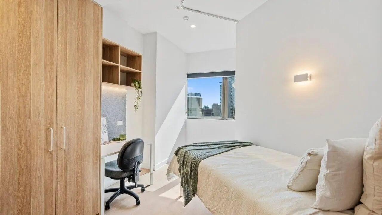 Bed desk wardrobe city view bedroom at UniLodge Brisbane City in Brisbane Student Accommodation