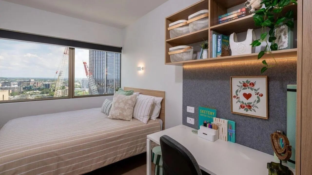 Bed desk shelves with baskets and art bedroom at UniLodge Brisbane City in Brisbane Student Accommodation