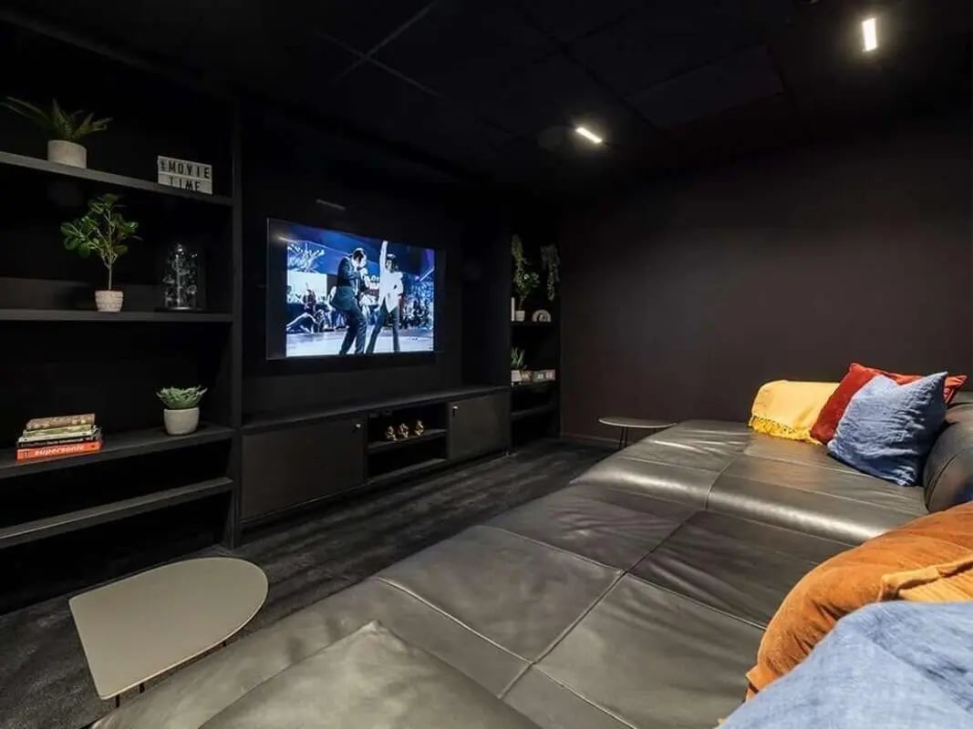 Large sectional sofa shelf plants TV playing area at Bridle Works Glasgow in Glasgow Student Accommodation