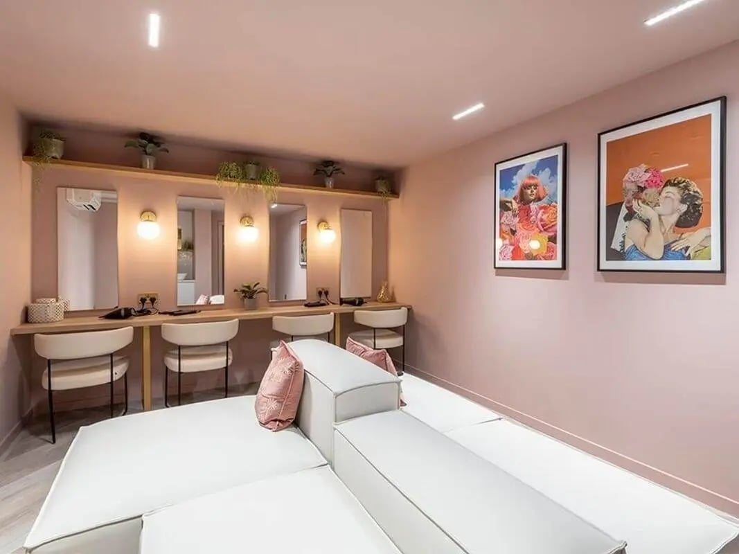 Mirrors lights chairs and a white sofa communal area at Bridle Works Glasgow in Glasgow Student Accommodation