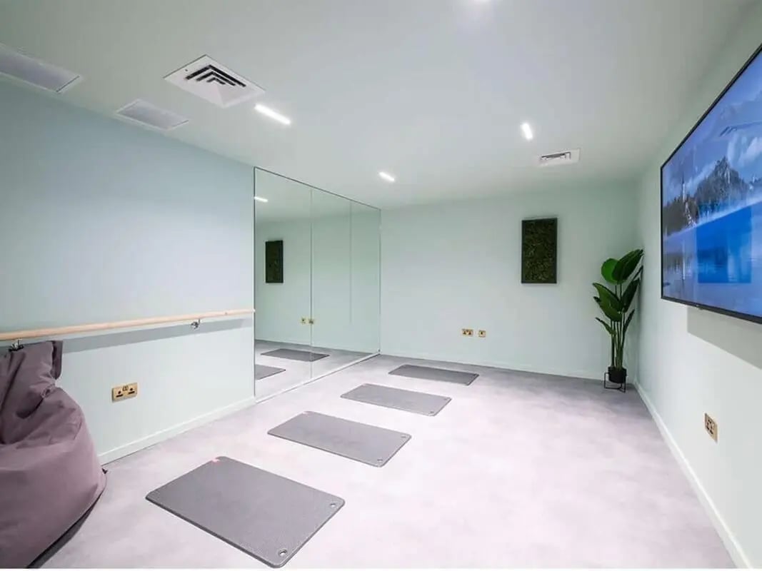 Yoga mats mirrors and plant activity room at Bridle Works Glasgow in Glasgow Student Accommodation